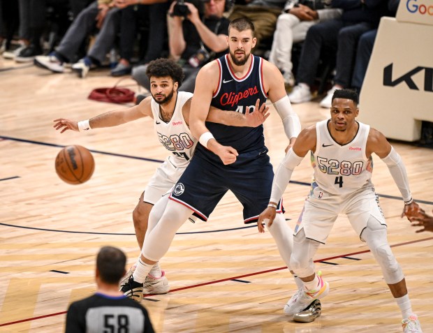 Jamal Murray (27) and Russell Westbrook (4) of the Denver...