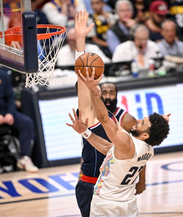 Jamal Murray (27) of the Denver Nuggets finishes over Ivica...