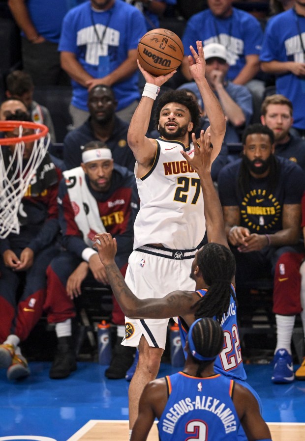 Jamal Murray (27) of the Denver Nuggets misses as he shoots over Cason Wallace (22) of the Oklahoma City Thunder during the second quarter at Paycom Center in Oklahoma City on Sunday, May 18, 2025. (Photo by AAron Ontiveroz/The Denver Post)