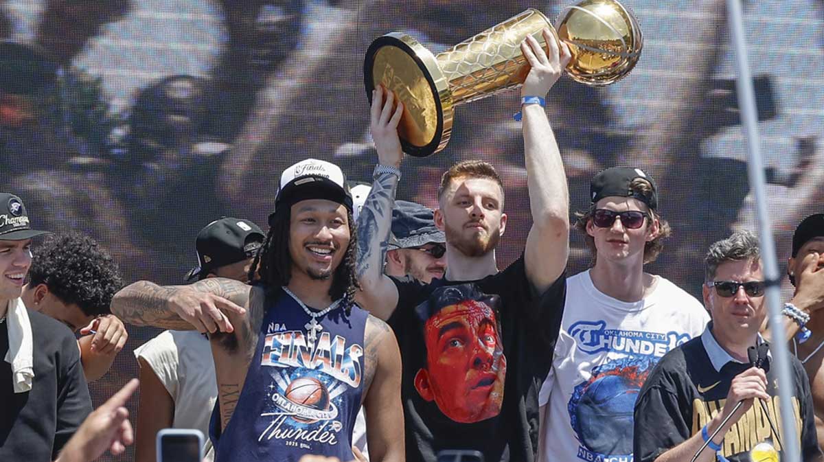 Thunder center Isaiah Hartenstein holds the Larry O'Brien Championship Trophy during the Oklahoma City Thunder Champions parade