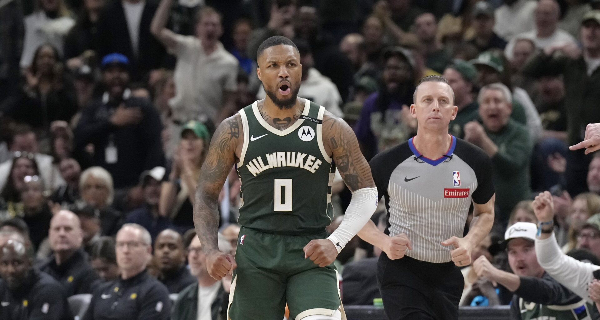 Milwaukee Bucks guard Damian Lillard (0) reacts after making a basket against the Indiana Pacers in the second half during game three of first round for the 2024 NBA Playoffs at Fiserv Forum.