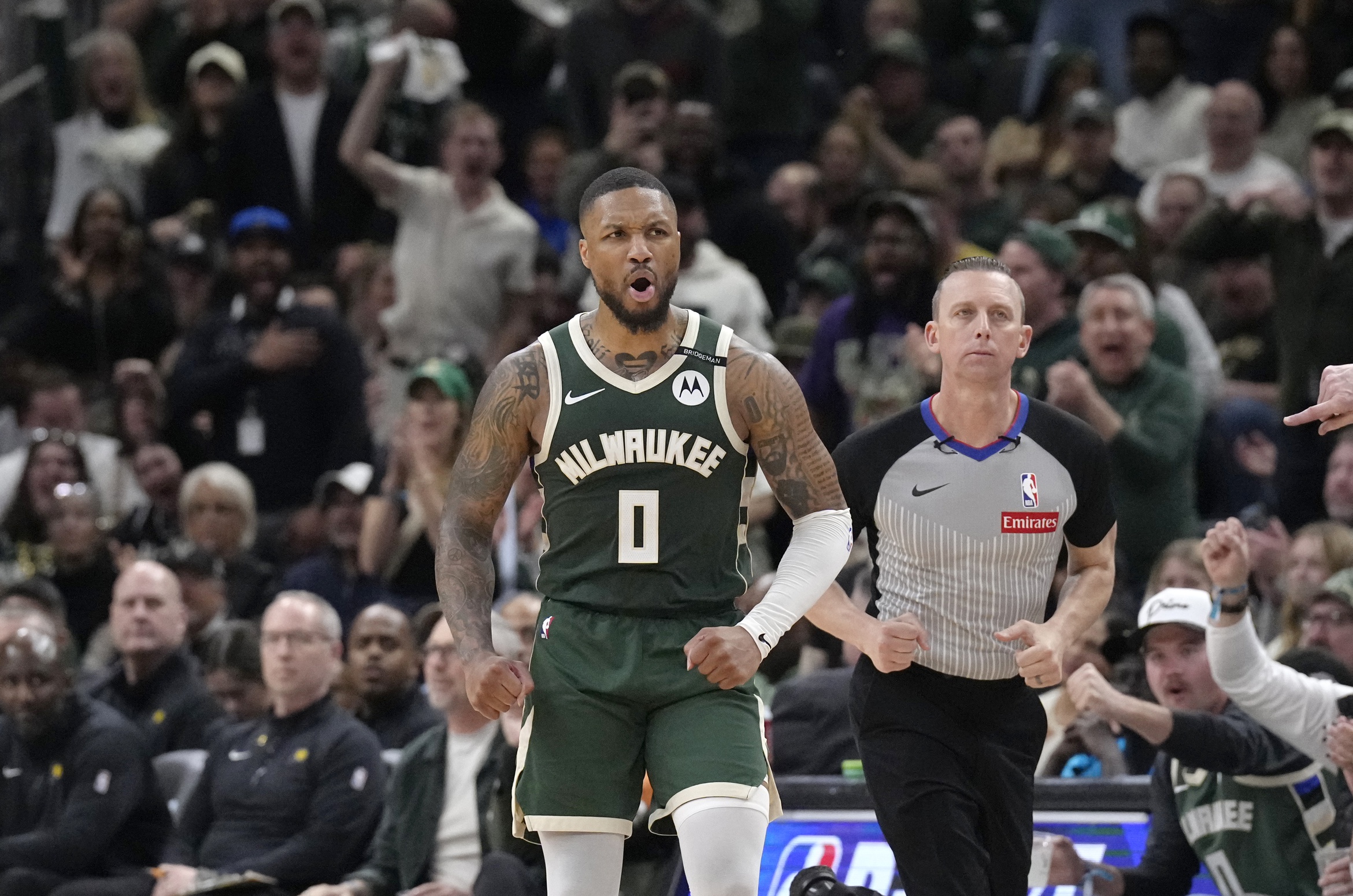 Milwaukee Bucks guard Damian Lillard (0) reacts after making a basket against the Indiana Pacers in the second half during game three of first round for the 2024 NBA Playoffs at Fiserv Forum.