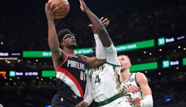 Portland Trail Blazers guard Scoot Henderson (00) shoots the ball against Boston Celtics guard Jrue Holiday (4) during the first half at TD Garden.