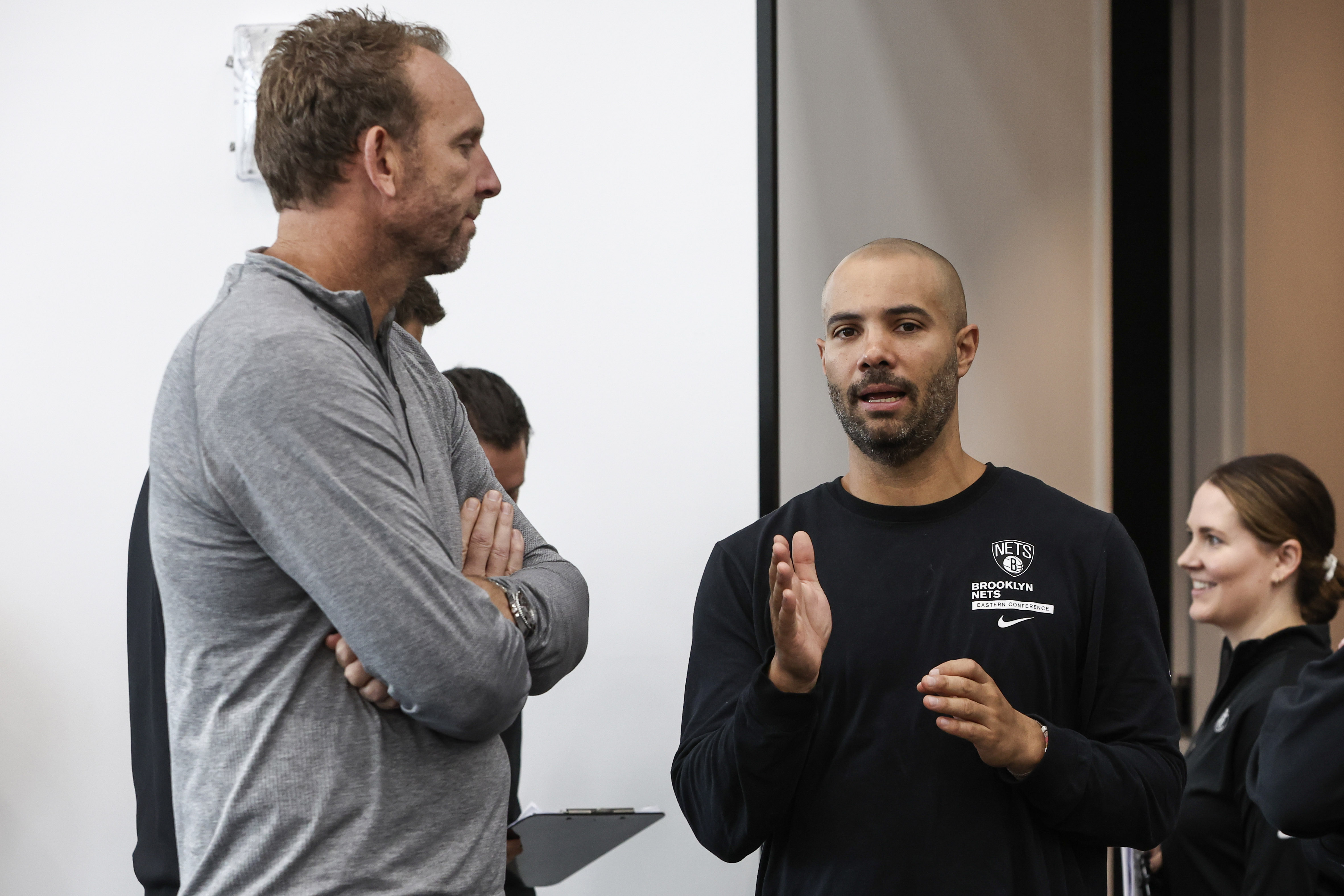 Brooklyn Nets General Manager Sean Marks (left) speaks to head coach Jordi Fernandez (right) during media day at HSS Training Center.