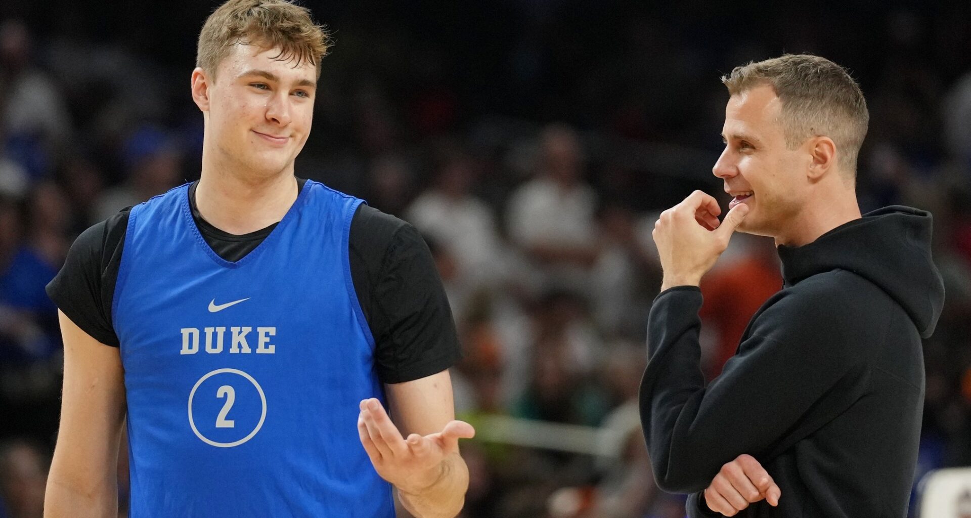 Jon Scheyer chatting with Cooper Flagg but will now be looking for Duke Basketball Director of Player Development.