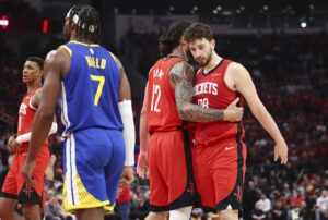 Houston Rockets center Steven Adams (12) talks with center Alperen Sengun (28) after a play during the third quarter against the Golden State Warriors at Toyota Center.