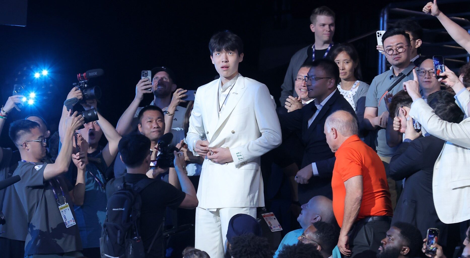 Jun 25, 2025; Brooklyn, NY, USA; Yang Hansen walks to the stage after being selected as the 16th pick by the Memphis Grizzlies in the first round of the 2025 NBA Draft at Barclays Center. Mandatory Credit: Brad Penner-Imagn Images