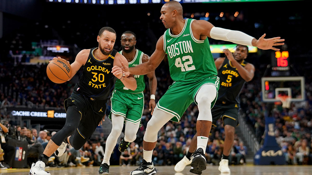 Warriors' Stephen Curry dribbles vs. Celtics' Al Horford