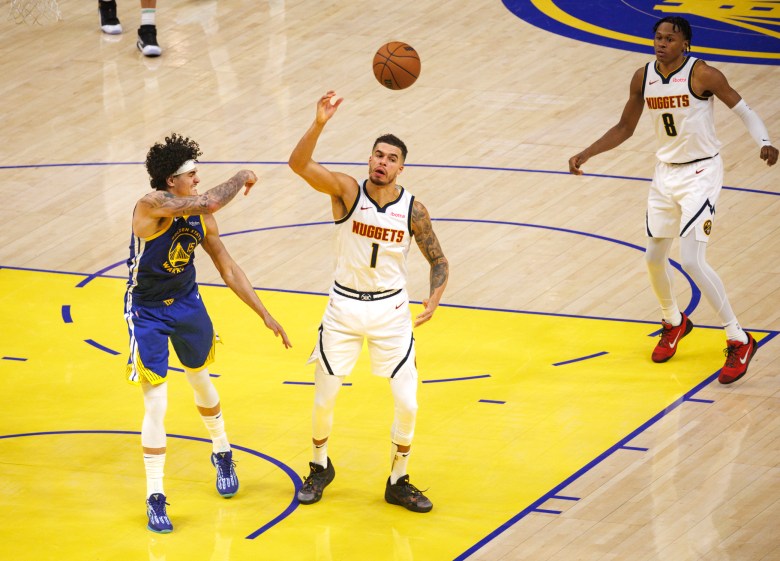 Gui Santos smacks the ball away from Nuggets Michael Porter Jr.