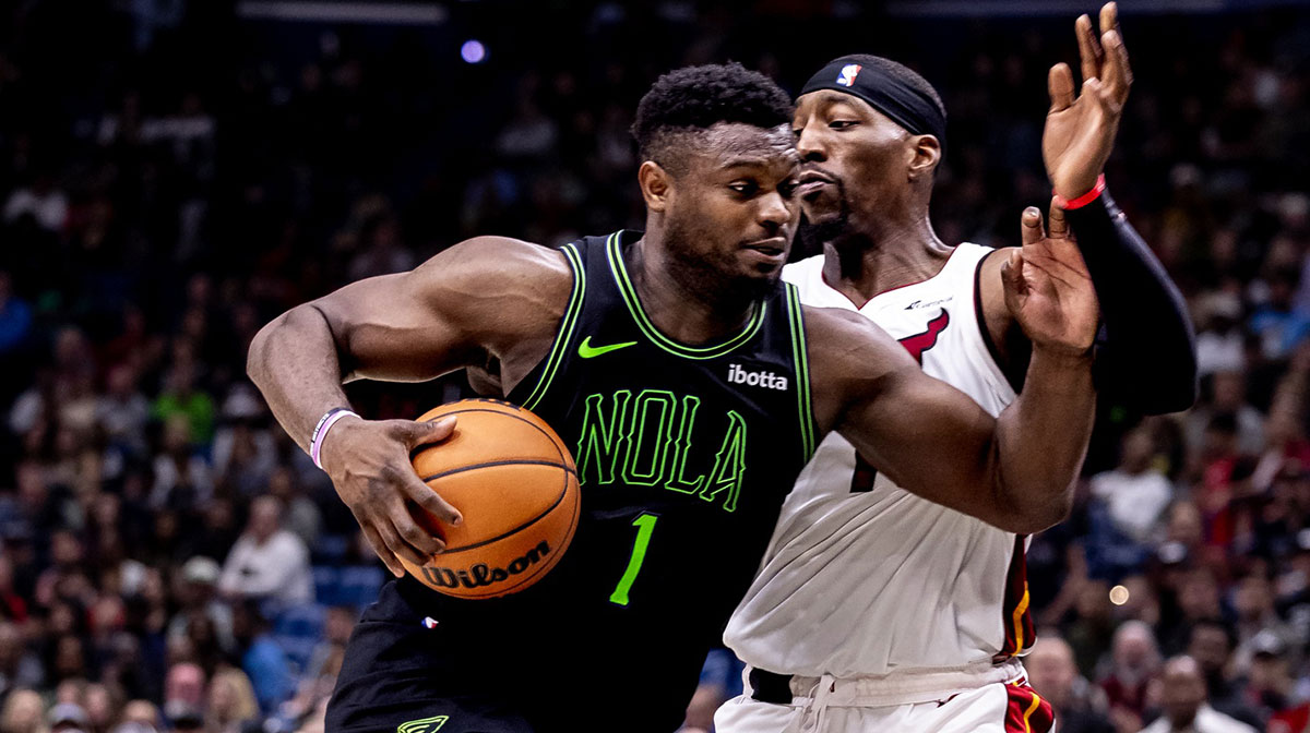 New Orleans Pelicans forward Zion Williamson (1) drives to the basket against Miami Heat center Bam Adebayo (13) during the second half at Smoothie King Center.