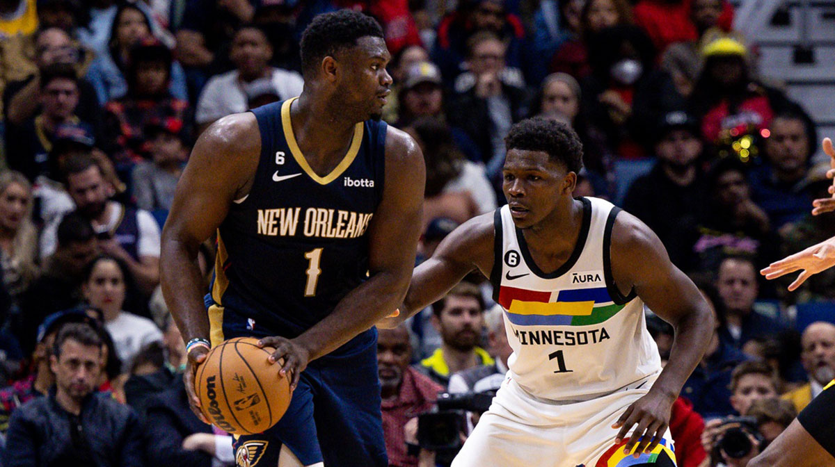 New Orleans Pelicans forward Zion Williamson (1) looks to pass against Minnesota Timberwolves guard Anthony Edwards (1) during the second half at Smoothie King Center.
