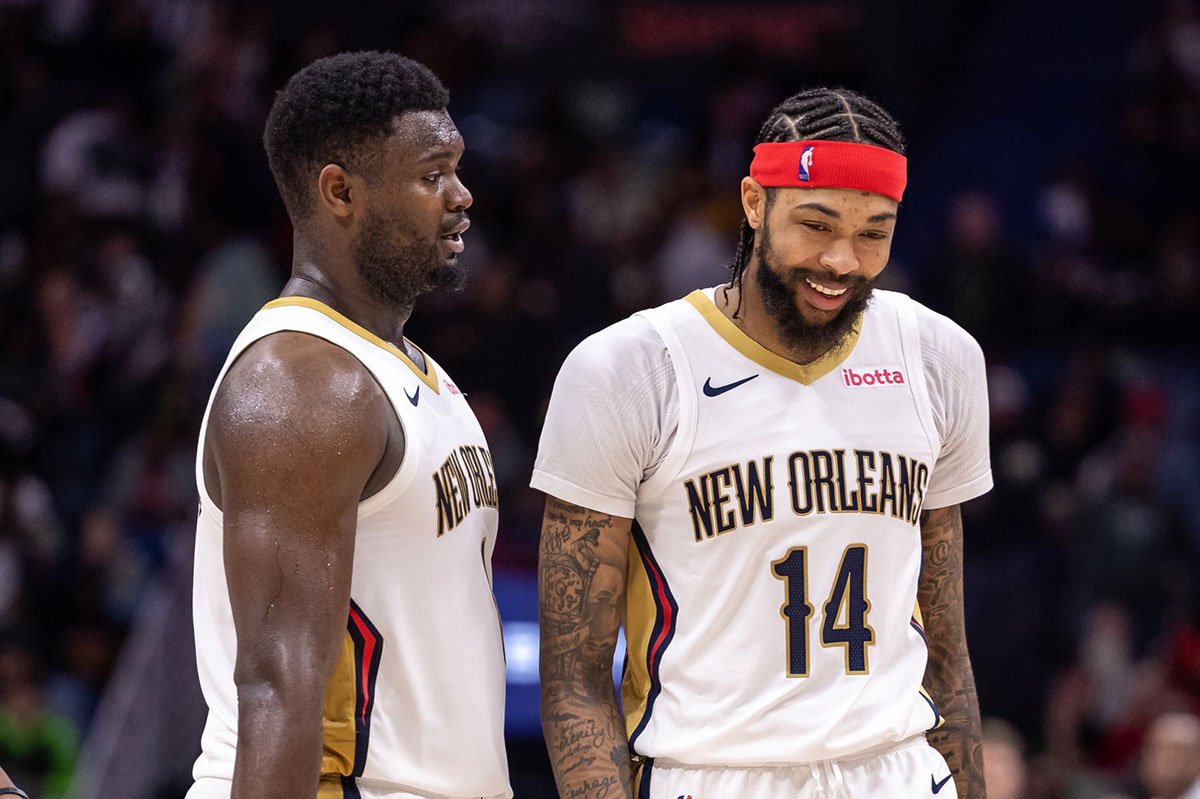 New Orleans Pelicans forward Zion Williamson (1) and forward Brandon Ingram (14) share a laugh after a play against the Los Angeles Lakers during the second half at Smoothie King Center.