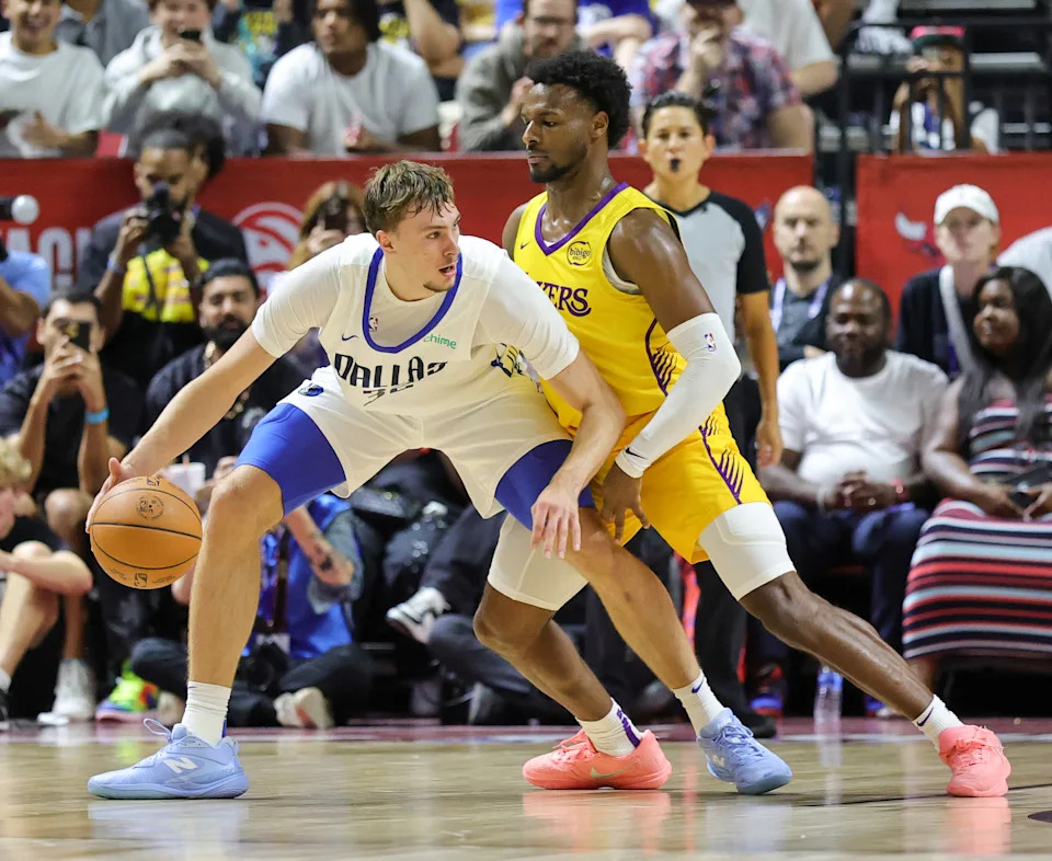 LAS VEGAS, NEVADA - JULY 10: Cooper Flagg #32 of the Dallas Mavericks is guarded by Bronny James #9 of the Los Angeles Lakers in the first half of a 2025 NBA Summer League game at the Thomas & Mack Center on July 10, 2025 in Las Vegas, Nevada. NOTE TO USER: User expressly acknowledges and agrees that, by downloading and or using this photograph, User is consenting to the terms and conditions of the Getty Images License Agreement. (Photo by Ethan Miller/Getty Images)