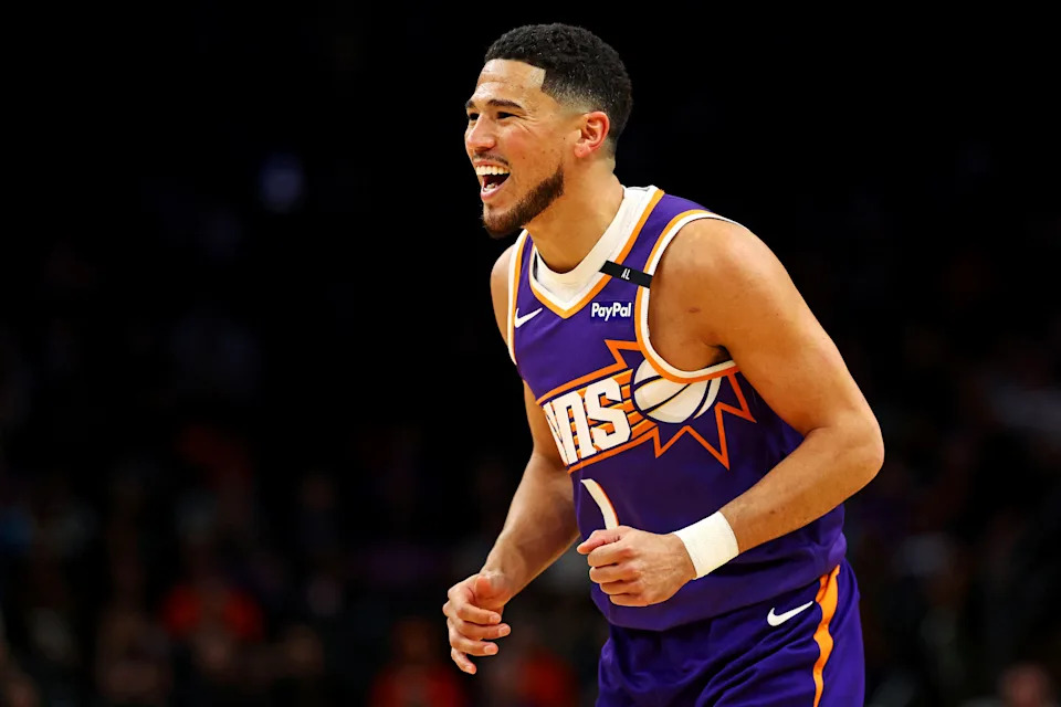 Mar 24, 2025; Phoenix, Arizona, USA; Phoenix Suns guard Devin Booker (1) reacts after a play during the first quarter against the Milwaukee Bucks at Footprint Center. Mandatory Credit: Mark J. Rebilas-Imagn Images