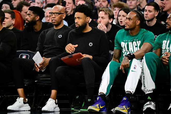 Assistant coach Amile Jefferson of the Boston Celtics looks on during the game against the New York Knicks at Madison Square Garden on February 24, 2024 in New York City. assistant coach amile jefferson of the boston celtics looks on during the game against the new york knicks at madison square garden on february 24, 2024 in new york city.