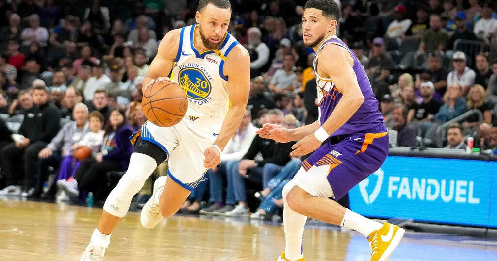 Curry scores 25 as the Warriors cruise past the Suns 133-95