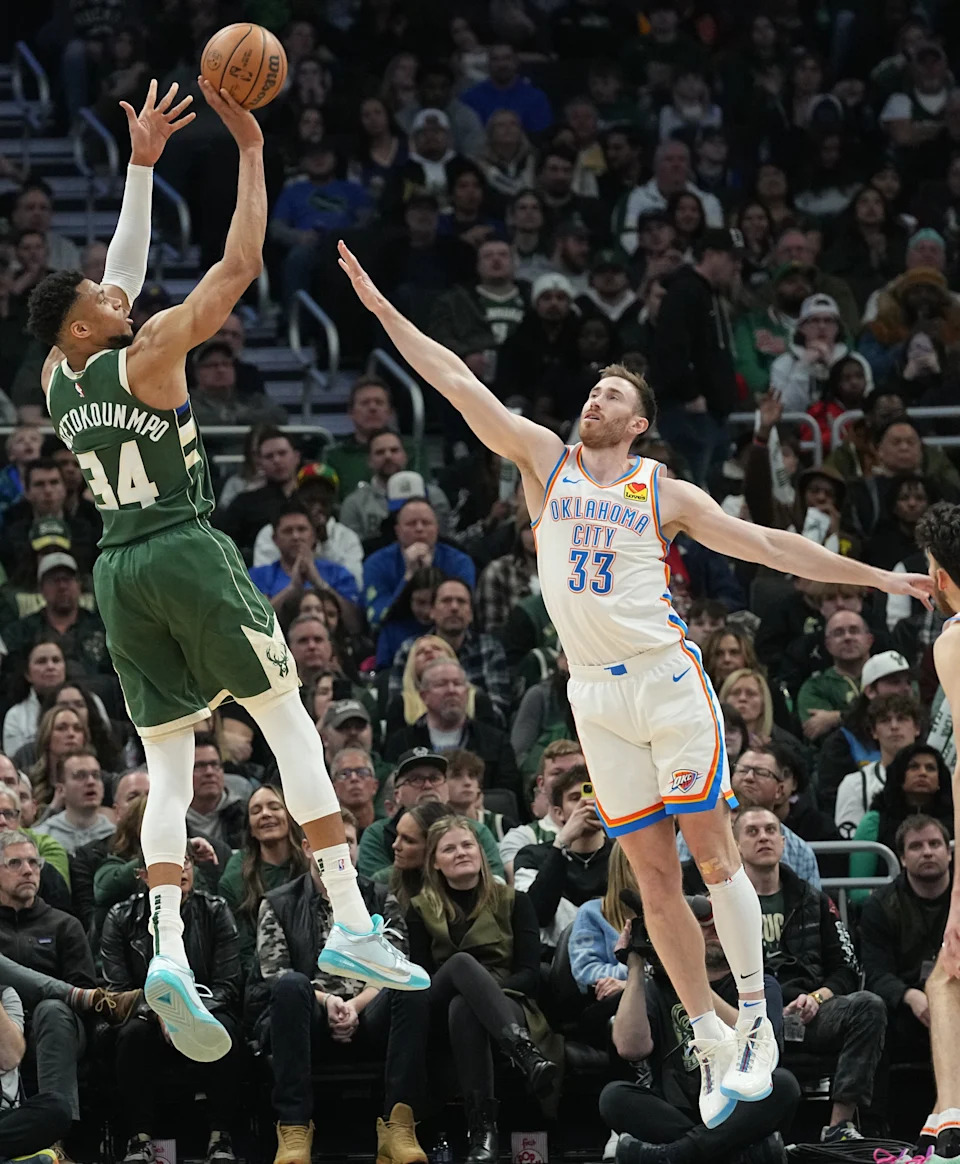 Milwaukee Bucks forward Giannis Antetokounmpo (34) shoots over Oklahoma City Thunder forward Gordon Hayward (33) during the second half of their game Sunday, March 24, 2024 at Fiserv Forum in Milwaukee, Wisconsin. The Milwaukee Bucks beat the Oklahoma City Thunder 118-93.