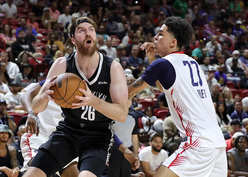 LAS VEGAS, NEVADA - JULY 13: Drew Timme #26 of the Brooklyn Nets drives to the basket against Will Riley #27 of the Washington Wizards in the first half of a 2025 NBA Summer League game at the Thomas & Mack Center on July 13, 2025 in Las Vegas, Nevada. NOTE TO USER: User expressly acknowledges and agrees that, by downloading and or using this photograph, User is consenting to the terms and conditions of the Getty Images License Agreement. (Photo by Ethan Miller/Getty Images)