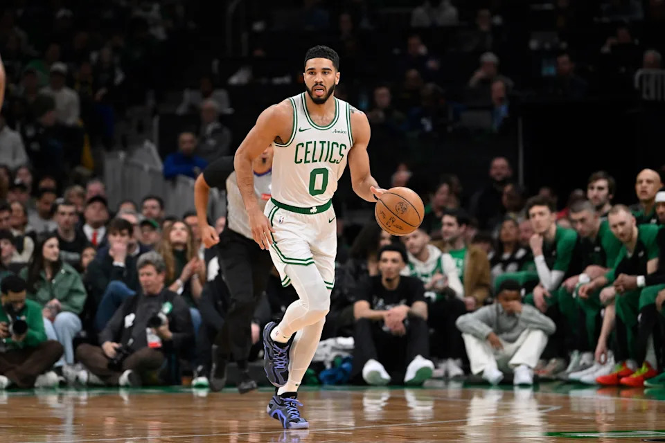 Boston Celtics forward Jayson Tatum dribbles the ball against the Charlotte Hornets during the first half at TD Garden.