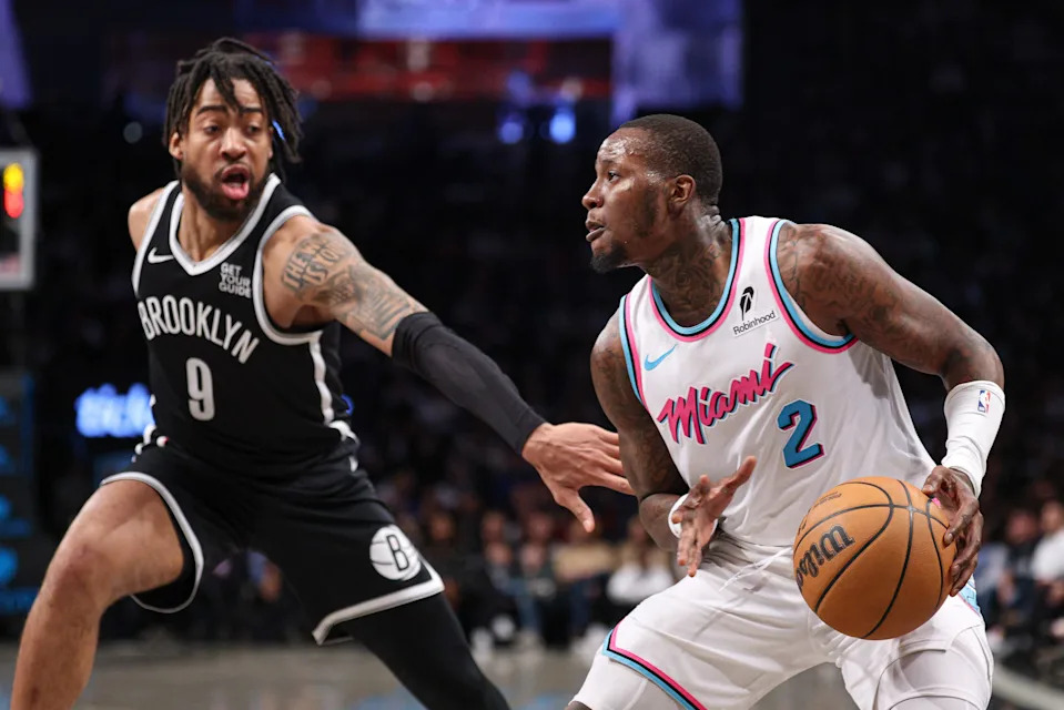 Feb 7, 2025; Brooklyn, New York, USA; Miami Heat guard Terry Rozier (2) is guarded by Brooklyn Nets forward Trendon Watford (9) during the second half at Barclays Center. Mandatory Credit: Vincent Carchietta-Imagn Images