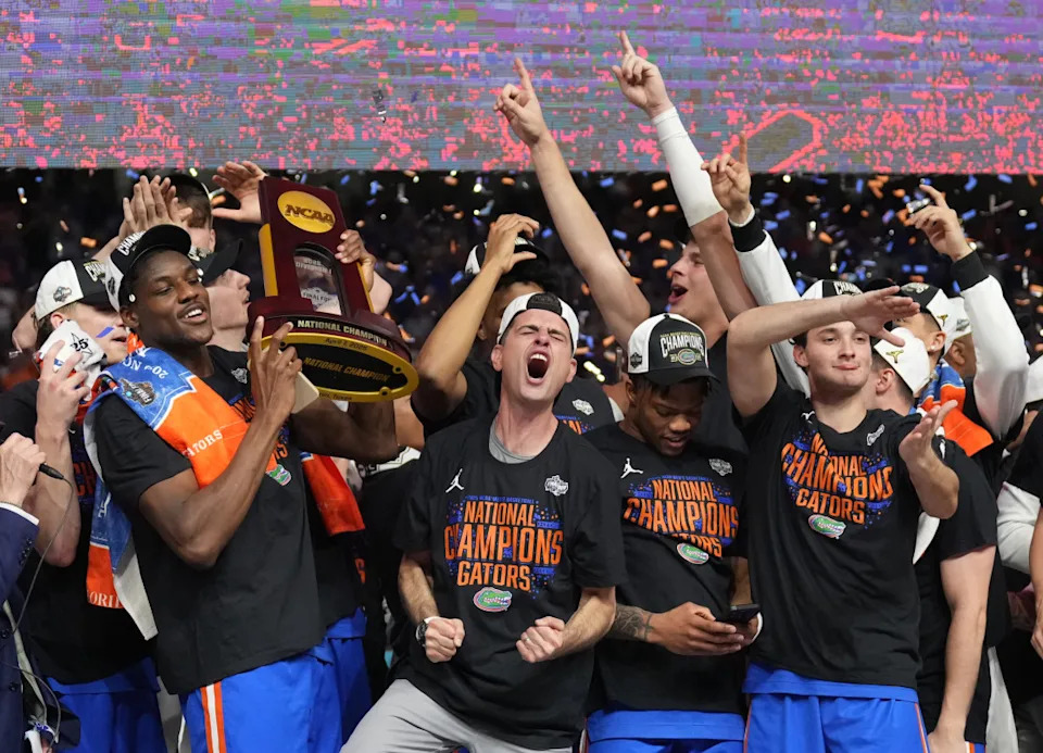 Apr 7, 2025; San Antonio, TX, USA; Florida Gators players hoist the trophy after defeating the Houston Cougars in the national championship game of the Final Four of the 2025 NCAA Tournament at the Alamodome. Mandatory Credit: Robert Deutsch-Imagn Images© Robert Deutsch-Imagn Images