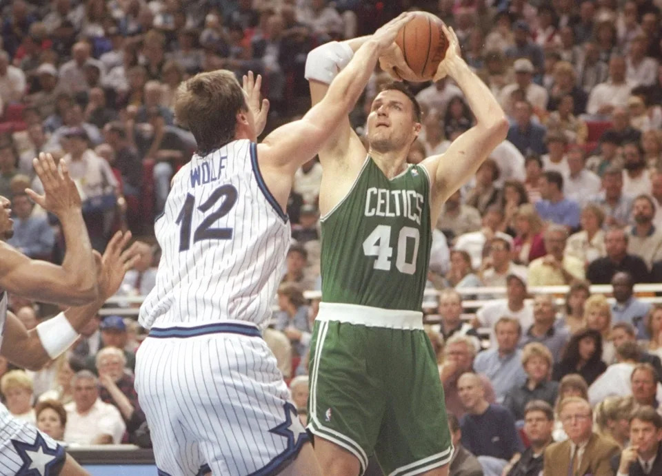 31 Jan 1996: Forward Dino Radja of the Boston Celtics tries to pass the ball as forward Joe Wolf of the Orlando Magic guards him during a game at Orlando Arena in Orlando, Florida. The Magic won the game 104 - 99. (Getty Images)