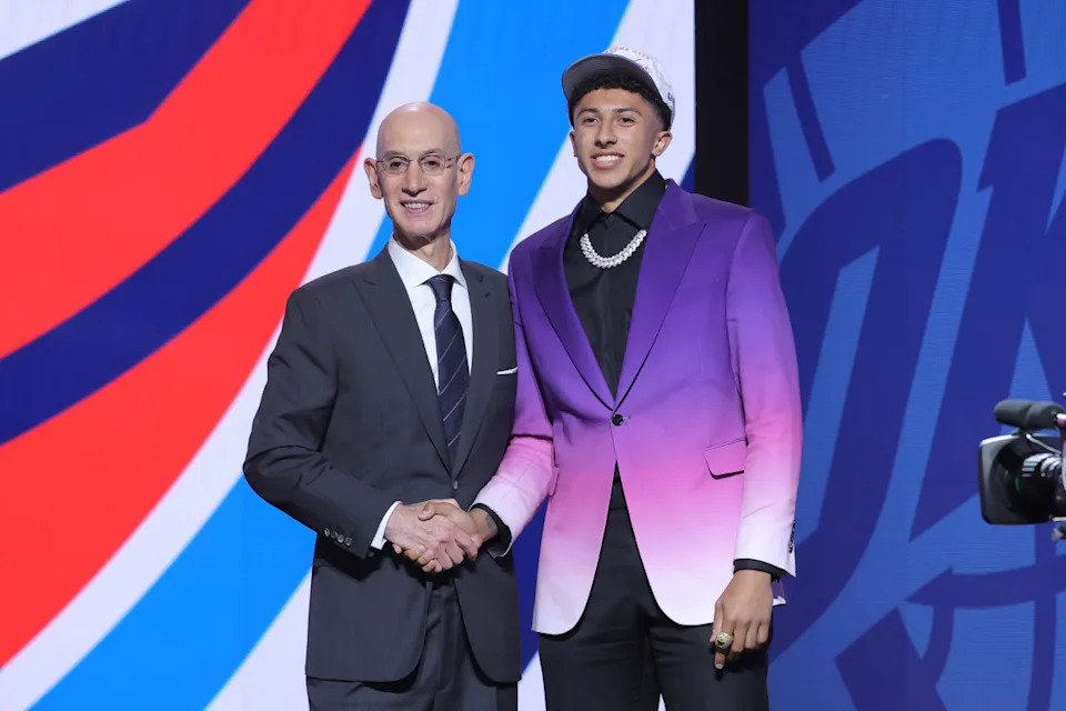 Nique Clifford stands with NBA commissioner Adam SilverBrad Penner-Imagn Images