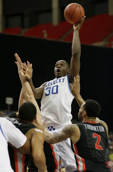 FILE – In this March 15, 2014 file photo, Kentucky forward Julius Randle (30) shoots over a Georgia defense during the first half of an NCAA college basketball game in the semifinal round of the Southeastern Conference men’s tournament in Atlanta. Randle is a possible pick in the 2014 NBA Draft, Thursday, June 26, 2014 in New York.(AP Photo/Steve Helber, File)