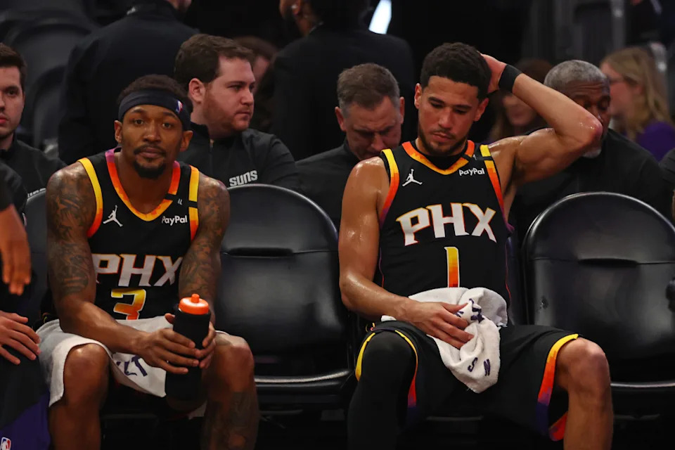 Apr 9, 2025; Phoenix, Arizona, USA; Phoenix Suns guard Bradley Beal (3) and guard Devin Booker (1) react on the bench against the Oklahoma City Thunder during the second half at Footprint Center. Mandatory Credit: Mark J. Rebilas-Imagn Images Mark J. Rebilas-Imagn Images