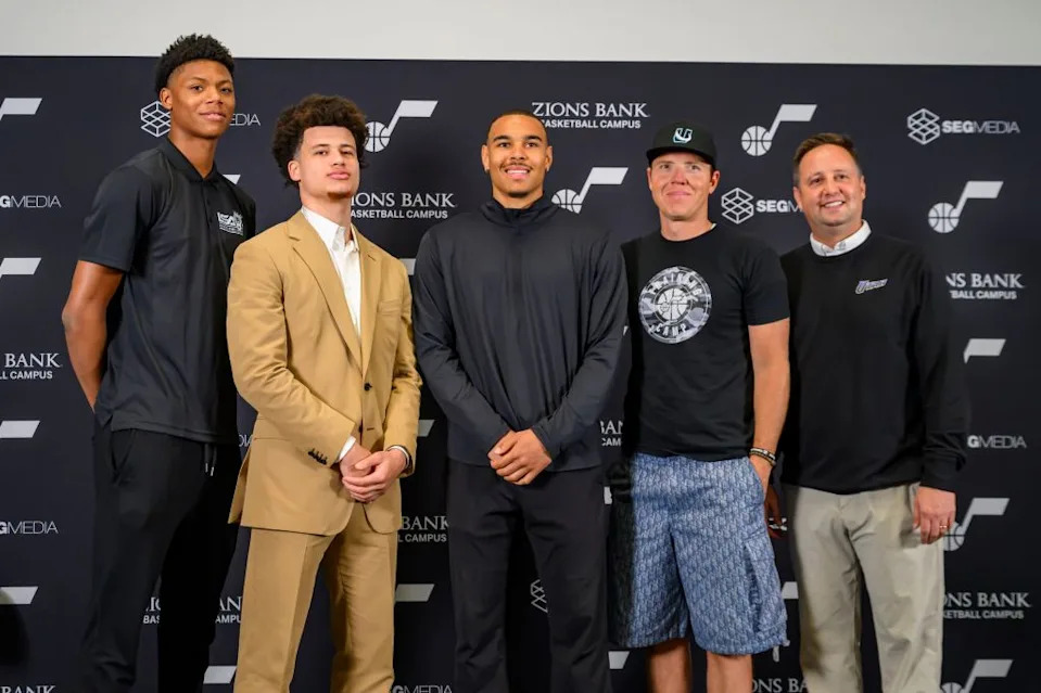 Utah Jazz drafted players, left to right, Ace Bailey, Walter Clayton Jr., John Tonje, team owner Ryan Smith, and Austin Ainge, President of Basketball Operations for the Utah Jazz, pose during the Utah Jazz player introduction press conference AP