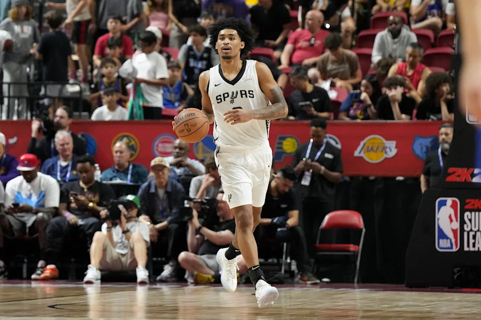 Jul 12, 2025; Las Vegas, NV, USA; San Antonio Spurs guard Dylan Harper (2) dribbles the ball against the Dallas Mavericks in the second quarter of their game at Thomas & Mack Center. Mandatory Credit: Candice Ward-Imagn Images