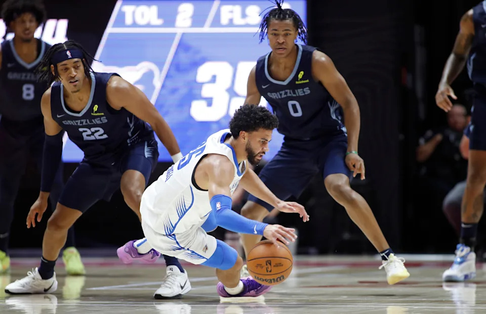 SALT LAKE CITY, UT - JULY 5: Ajay Mitchell #25 of the Oklahoma City Thunder looses control of the ball under pressure from Jaylen Wells #0 and Jeremy Jones #22 of the Memphis Grizzlies during the first half of their NBA Summer League game at the Jon M. Huntsman Center on July 5, 2025 in Salt Lake City, Utah.