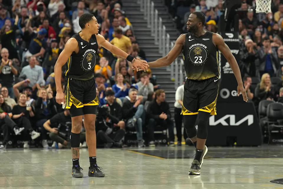 Golden State Warriors guard Jordan Poole (3) and forward Draymond Green (23) celebrate against the Utah Jazz.© Darren Yamashita-Imagn Images