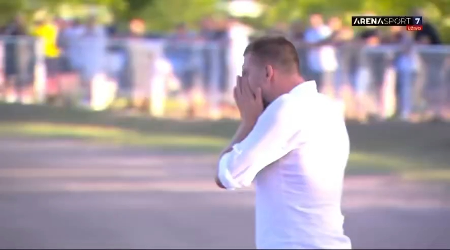 Man in white shirt crying.