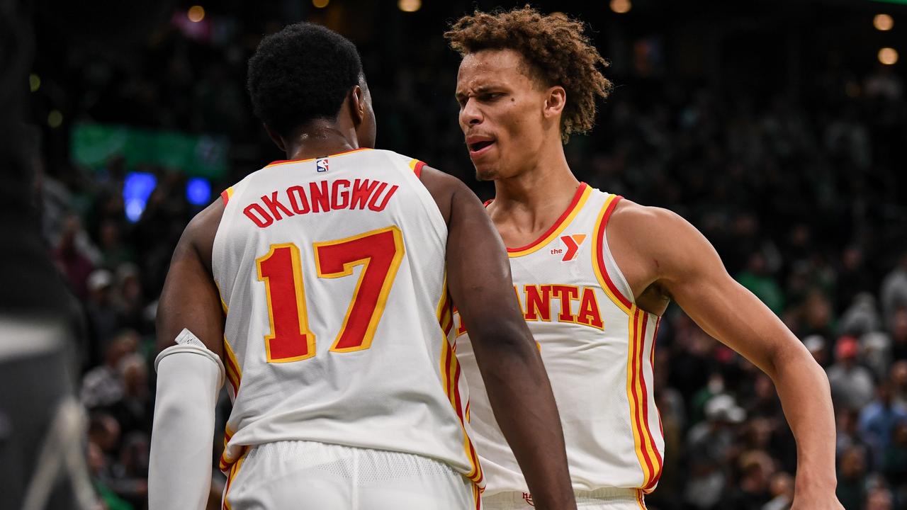 BOSTON, MASSACHUSETTS - NOVEMBER 12: Dyson Daniels #5 of the Atlanta Hawks celebrates a win with Onyeka Okongwu #17 against the Boston Celtics during Emirates NBA cup game at TD Garden on November 12, 2024 in Boston, Massachusetts. NOTE TO USER: User expressly acknowledges and agrees that, by downloading and or using this photograph, User is consenting to the terms and conditions of the Getty Images License Agreement. (Photo by China Wong/Getty Images)