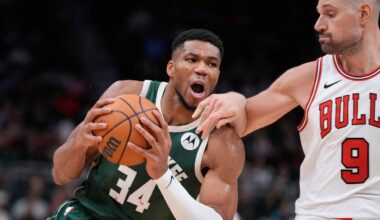 Milwaukee Bucks' Giannis Antetokounmpo drives on Chicago Bulls' Nikola Vucevic during the second half of an NBA basketball game.