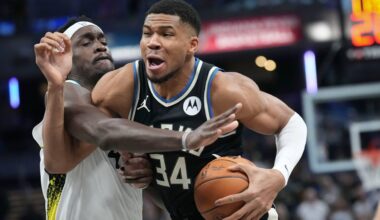 Milwaukee Bucks forward Giannis Antetokounmpo, right, goes around Indiana Pacers forward Pascal Siakam (43) during the first half of an NBA basketball game in Indianapolis, Tuesday, Dec. 31, 2024.