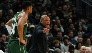 Milwaukee Bucks head coach Doc Rivers, right, gestures as he talks with Giannis Antetokounmpo
