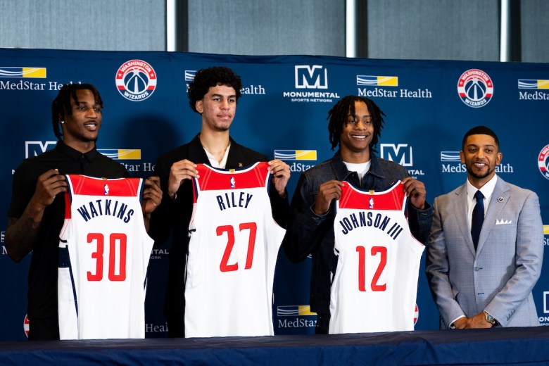 2025 NBA Draft picks Jamir Watkins (left), Will Riley (center) and Tre Johnson (right) and Wizards General Manager Will Dawkins (far right) at the Wizards Introductory Press Conference on June 28 (Marcus Relacion/The Washington Informer)