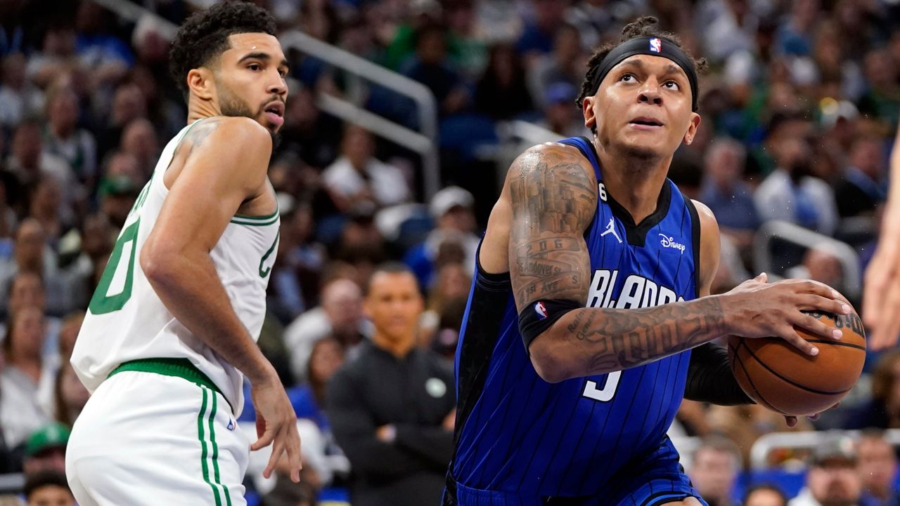The Celtics' Jason Tatum (left) and the Magic's Paolo Banchero are expected to play major roles in their teams' Eastern Conference first-round playoff series starting Sunday in Boston. (AP Photo/John Raoux)