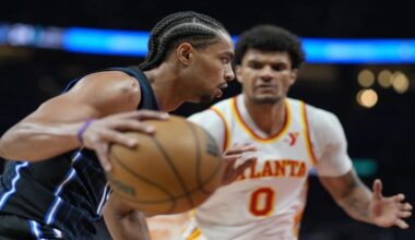 Orlando Magic guard Jett Howard (13) drives against Atlanta Hawks forward Dominick Barlow (0) during the first half of an NBA basketball game, Sunday, April 13, 2025, in Atlanta. (AP Photo/Mike Stewart)
