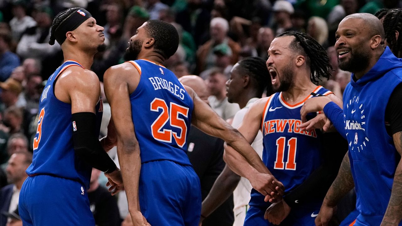 New York Knicks celebrate after defeating the Boston Celtics in Game 1 of an NBA basketball second-round playoff series Monday, May 5, 2025, in Boston. (AP Photo/Charles Krupa)