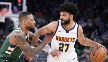 Denver Nuggets' Jamal Murray tries to get past Milwaukee Bucks' Damian Lillard during the first half of an NBA basketball game Thursday, Feb. 27, 2025, in Milwaukee.