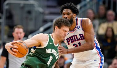 Milwaukee Bucks' Brook Lopez, left, drives against Philadelphia 76ers' Joel Embiid, right, during the first half of an NBA basketball game Sunday, Feb. 9, 2025, in Milwaukee. (AP Photo/Andy Manis)