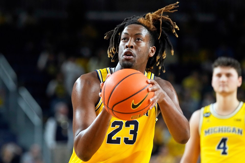 Michigan basketball player Gregg Glenn III shooting a free throw.