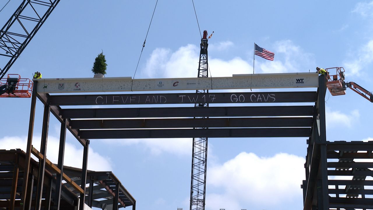 The workers putting the final steel beam on the infrastructure (Cierra Campbell)
