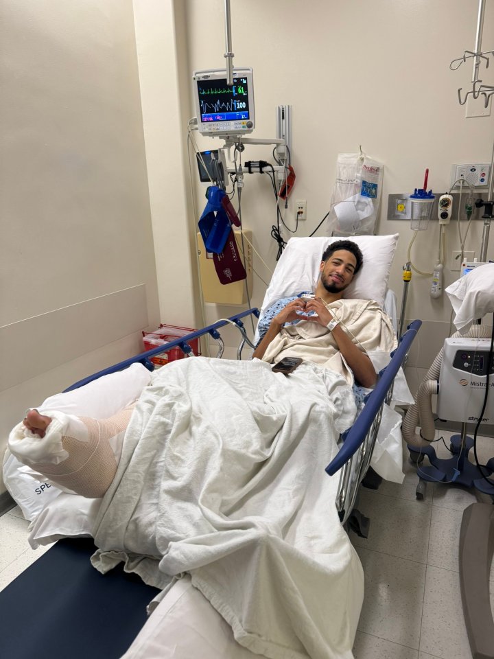 Tyrese Haliburton in a hospital bed with a leg cast.