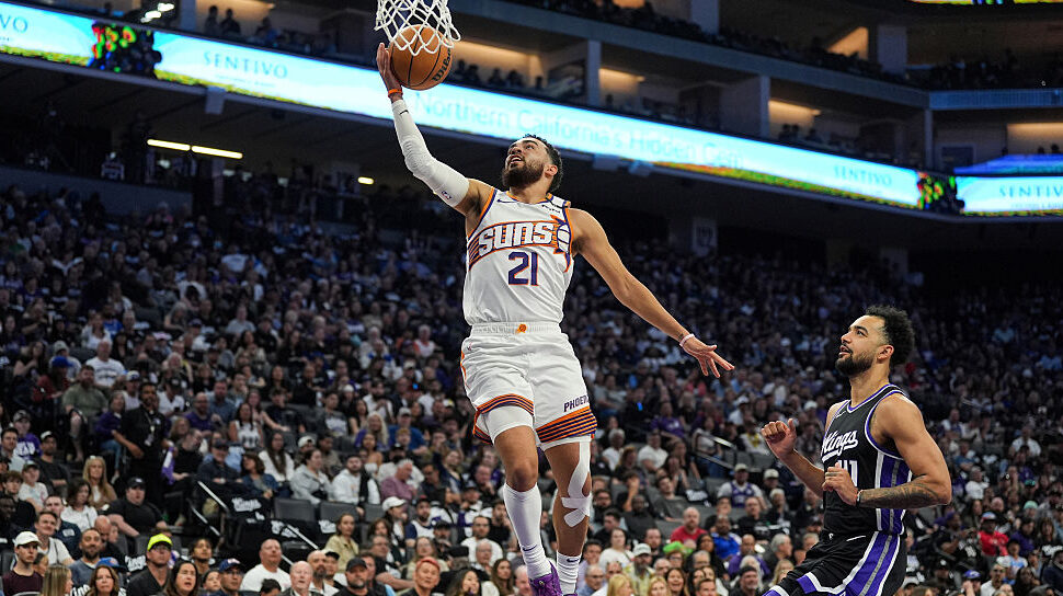 Suns PG Tyus Jones goes up for the shot...