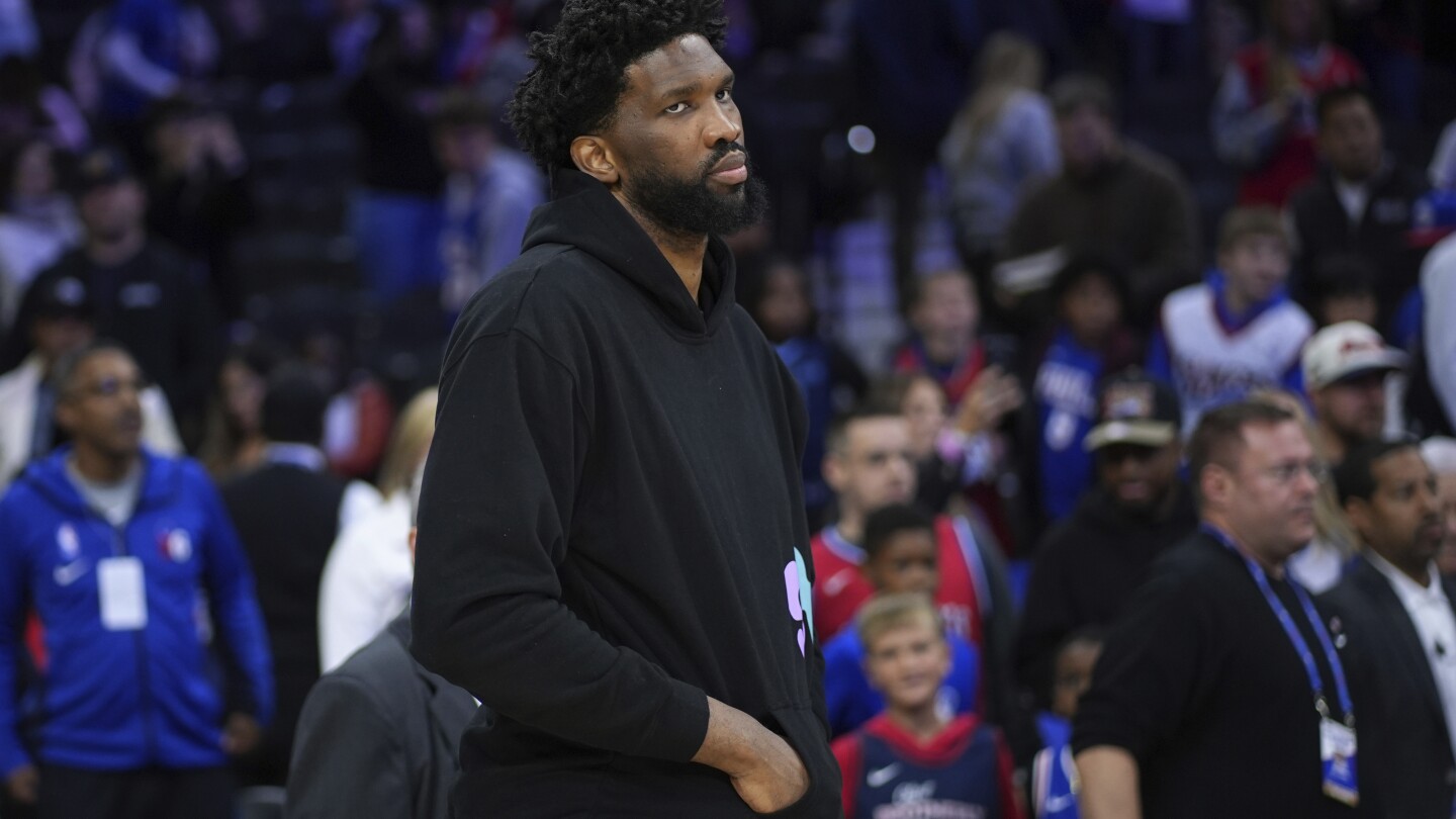 76ers' Joel Embiid is suspended by the NBA for three games for shoving a newspaper columnist