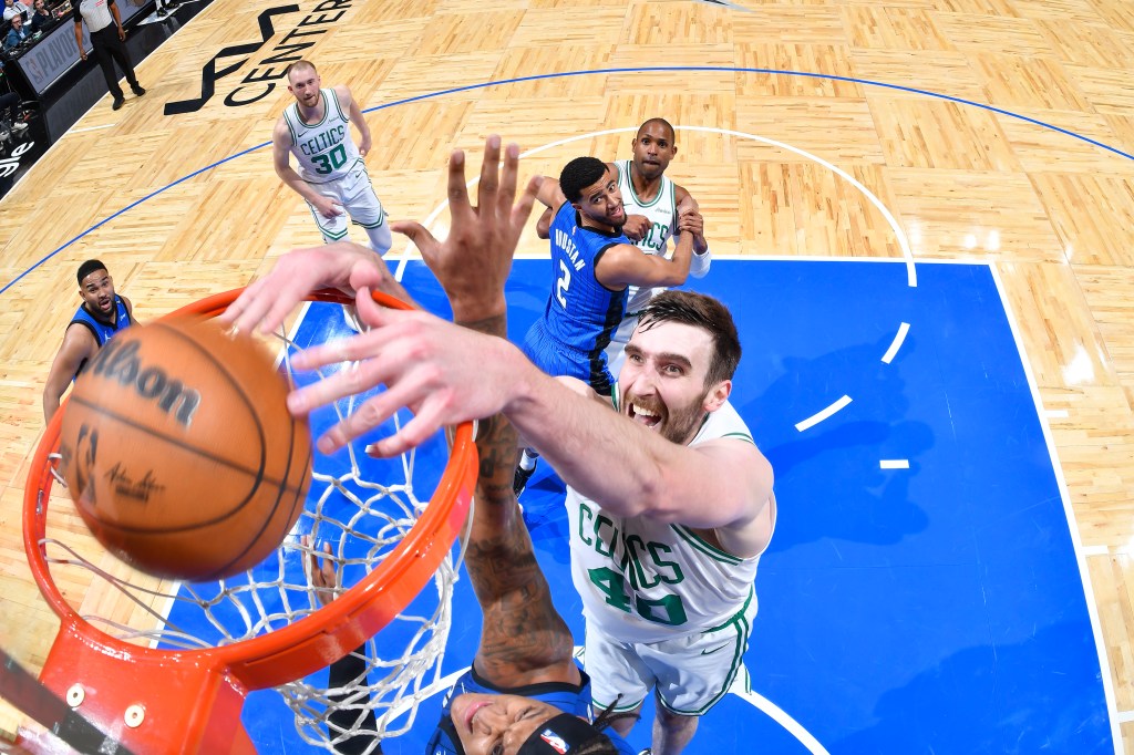 Luke Kornet #40 of the Boston Celtics dunking during an NBA Playoffs game.